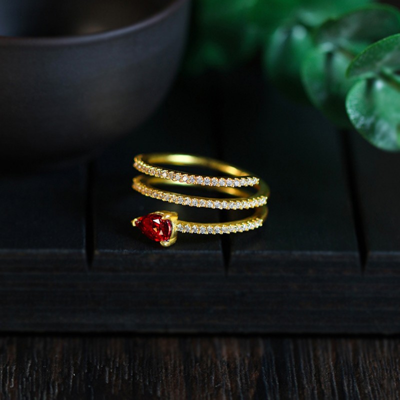 Ring with Gold Plating and Garnet Teardrop Inlay